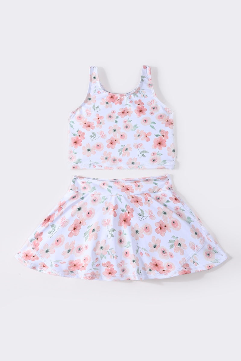 Bright floral two-piece swimsuit for girls, perfect for summer beach days.