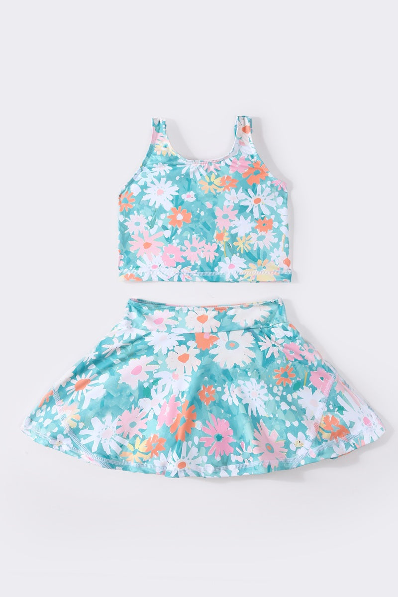 Bright, floral swimsuit with daisies, perfect for sunny beach days.