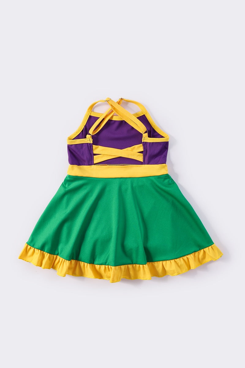 Colorful Mardi Gras-themed dress with playful ruffles, perfect for festive celebrations.