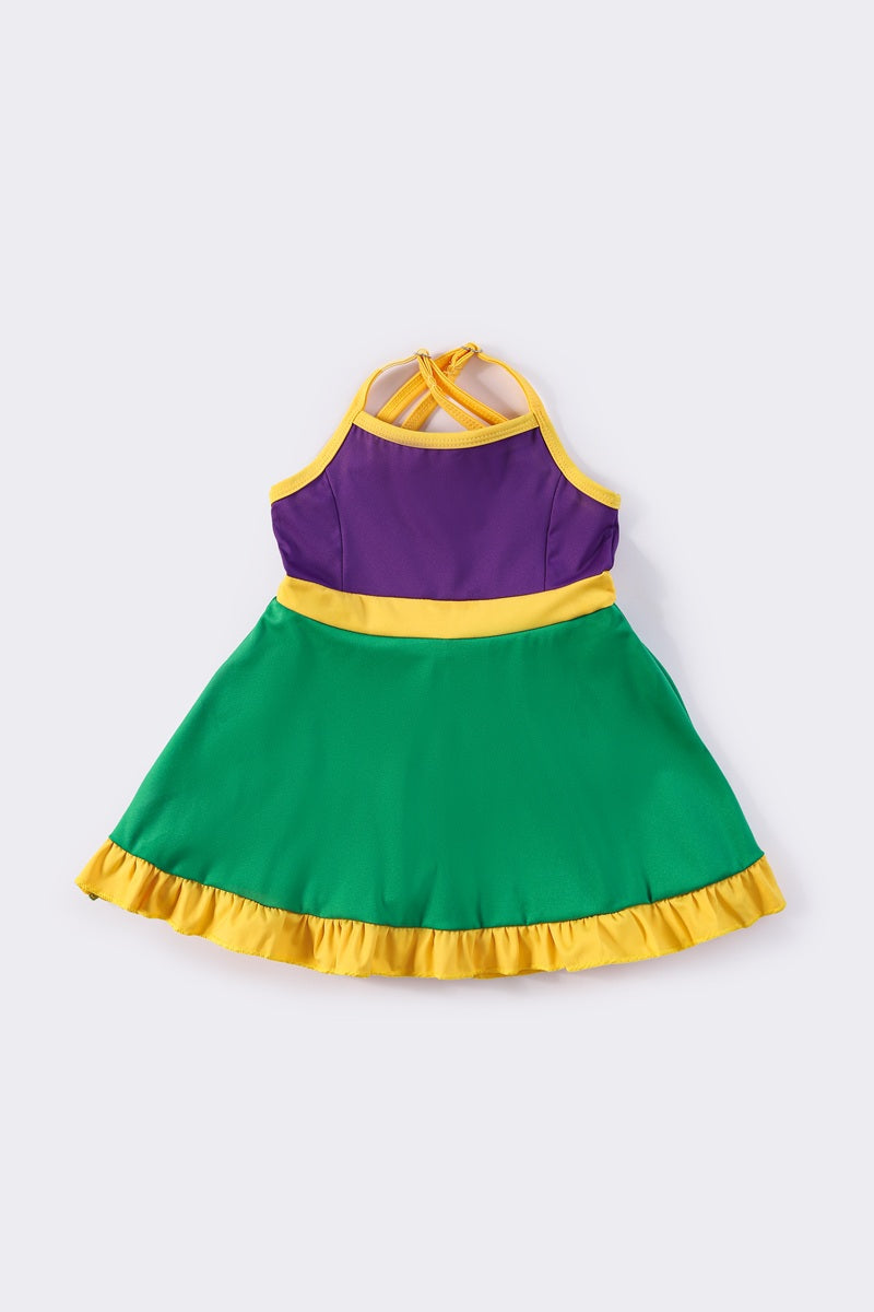 Colorful Mardi Gras-themed dress with playful ruffles, perfect for festive celebrations.