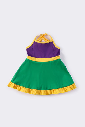 Colorful Mardi Gras-themed dress with playful ruffles, perfect for festive celebrations.