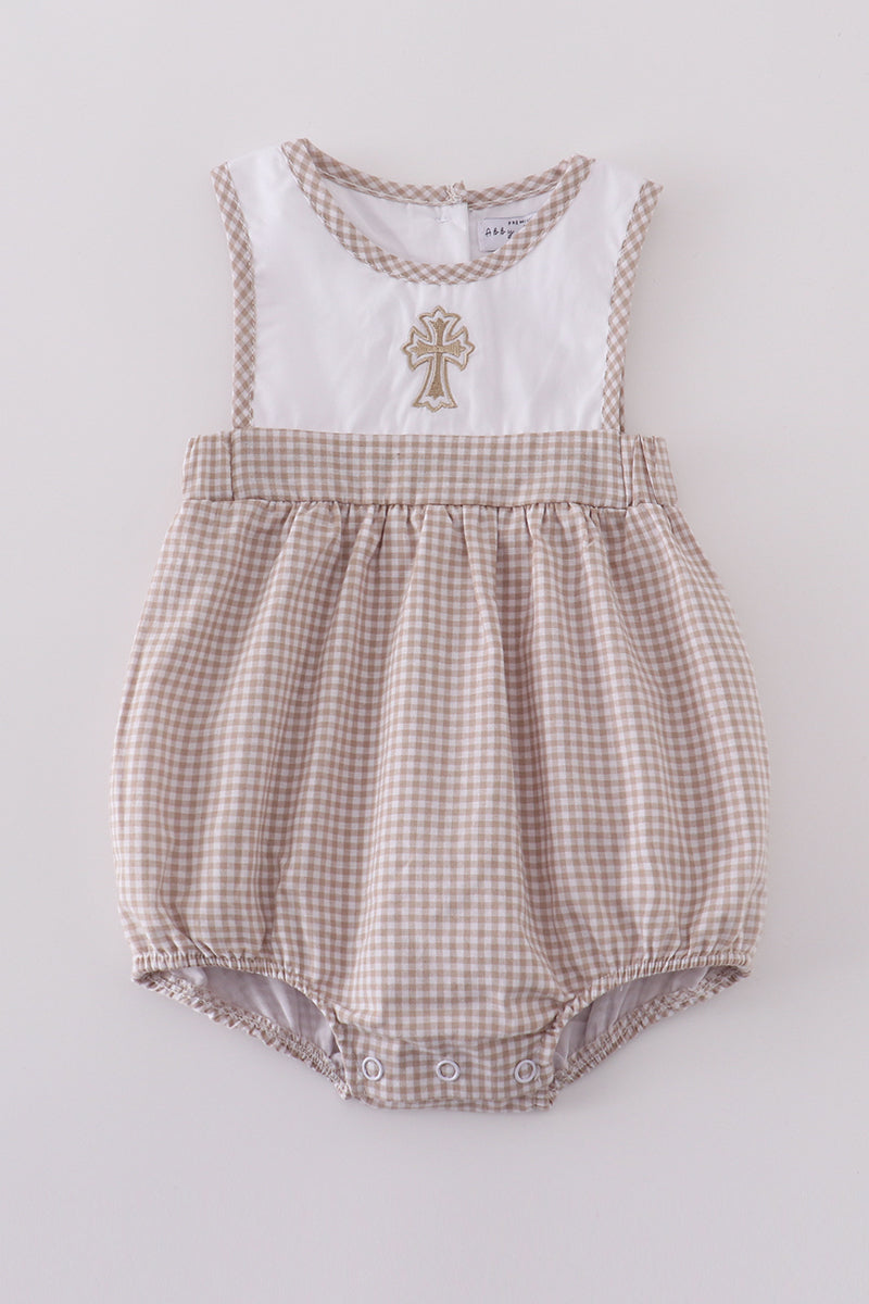 Adorable bubble romper with intricate cross embroidery, perfect for special occasions.
