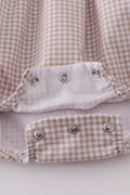 Adorable bubble romper with intricate cross embroidery, perfect for special occasions.