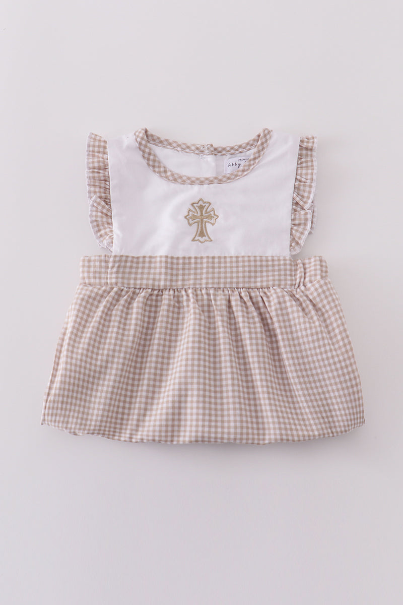 A cozy, pastel-colored bubble romper with delicate cross embroidery for toddlers.