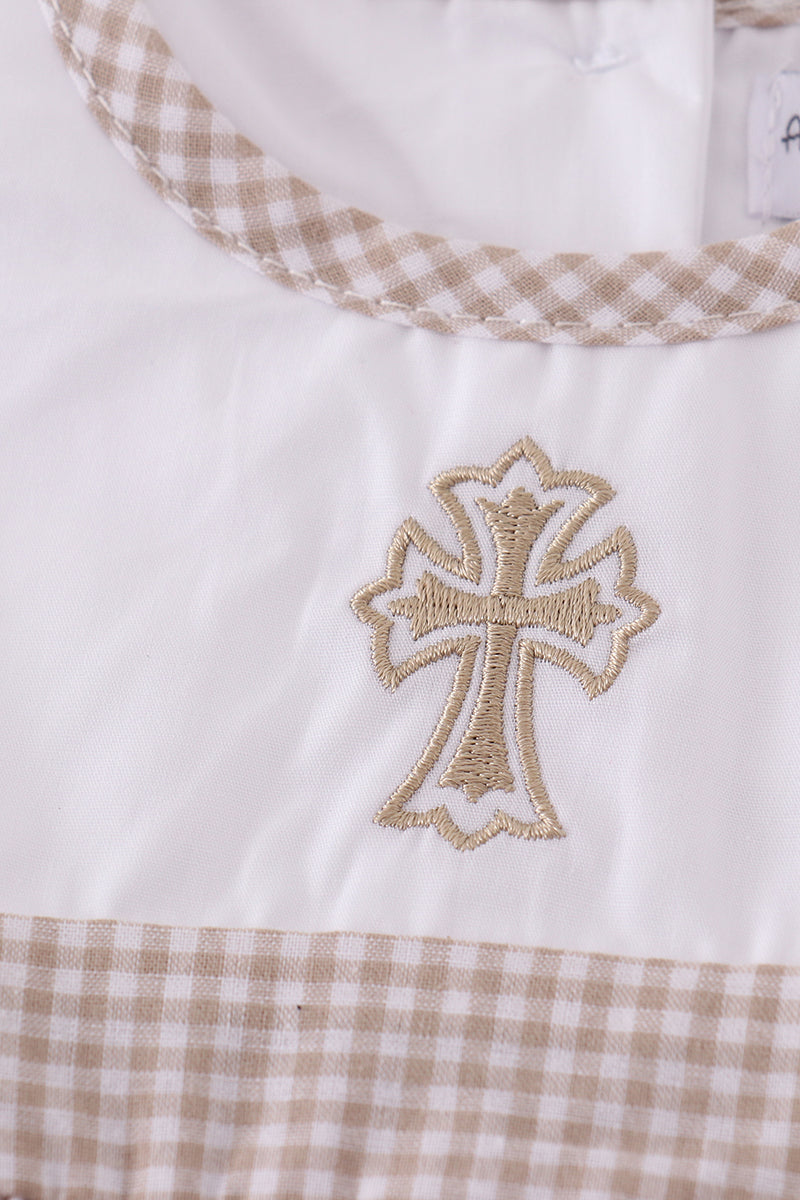 A cozy, pastel-colored bubble romper with delicate cross embroidery for toddlers.