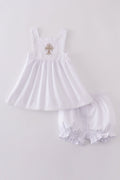 Soft, white romper with delicate cross embroidery, perfect for cozy playtime.