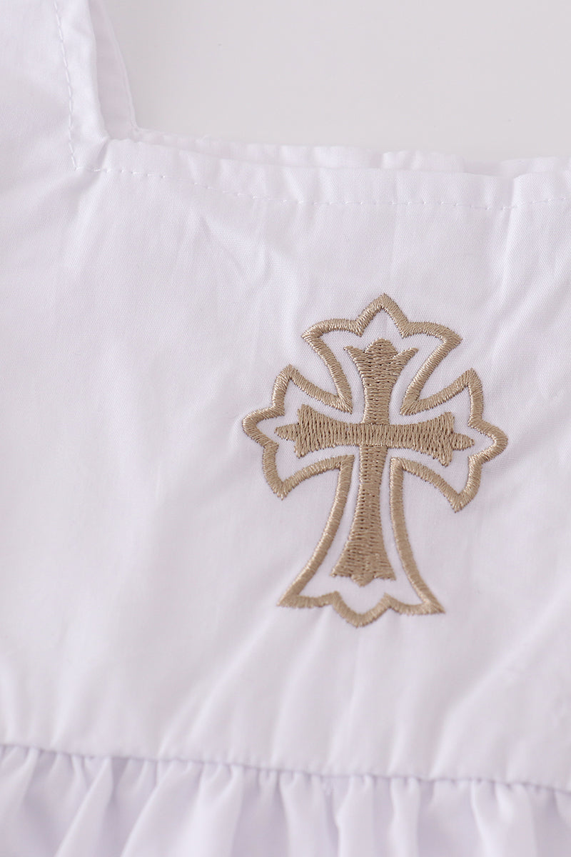 Soft, white romper with delicate cross embroidery, perfect for cozy playtime.