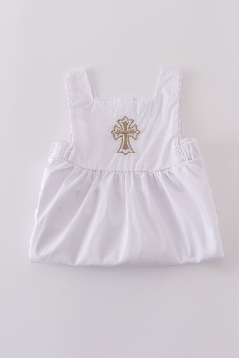 Soft, white romper with delicate cross embroidery, perfect for cozy playtime.