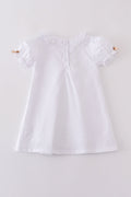 Premium cross embroidery dress in soft pastel hues, perfect for special occasions.