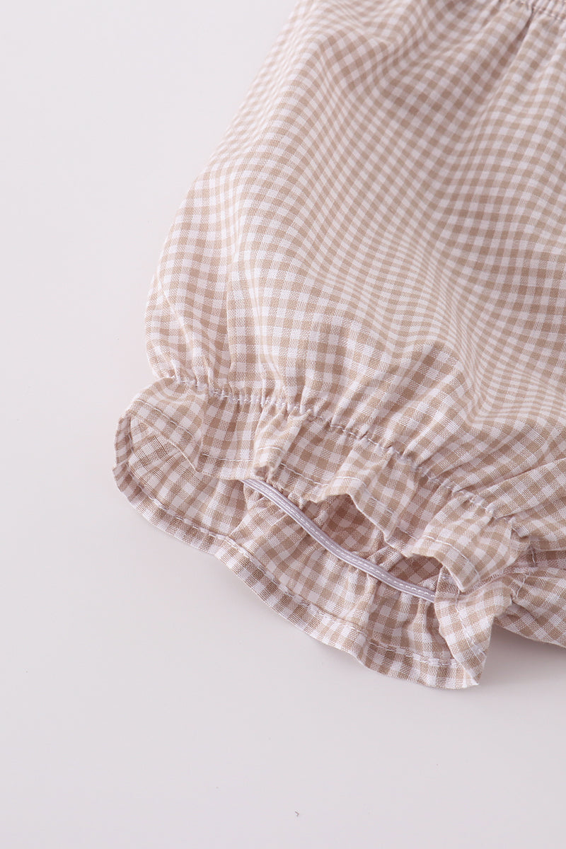 A cozy, embroidered bloomer set with cross patterns, perfect for toddlers.