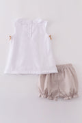 A cozy, embroidered bloomer set with cross patterns, perfect for toddlers.