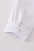 Cozy long sleeve shirt with cross embroidery, perfect for little adventurers.