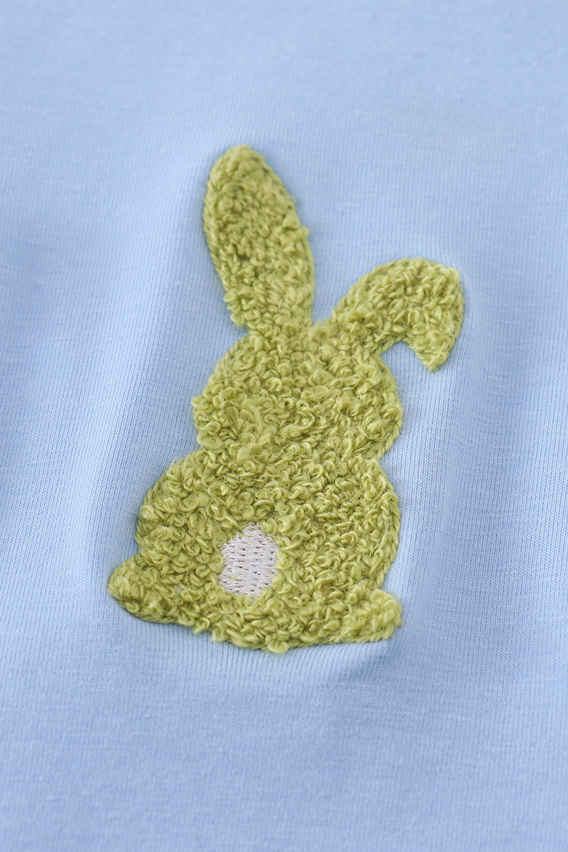 Cozy blue top with adorable bunny embroidery, perfect for playful adventures.