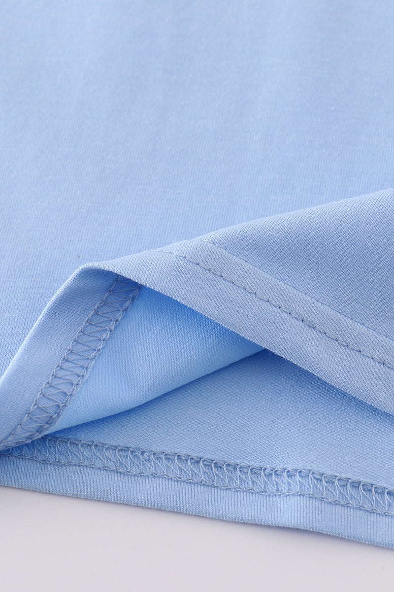 Cozy blue top with adorable bunny embroidery, perfect for playful adventures.