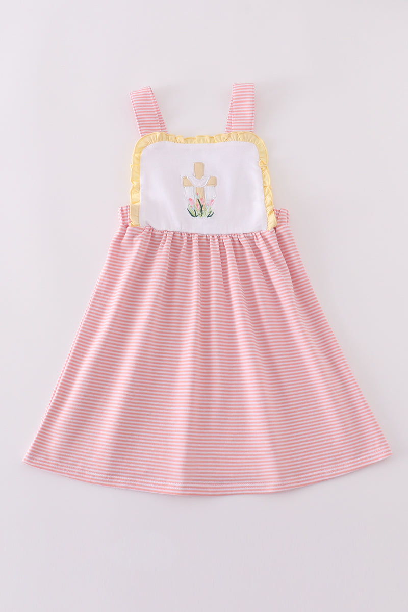 A charming pink dress with delicate cross embroidery, perfect for special occasions.