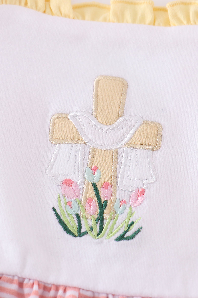 A charming pink dress with delicate cross embroidery, perfect for special occasions.