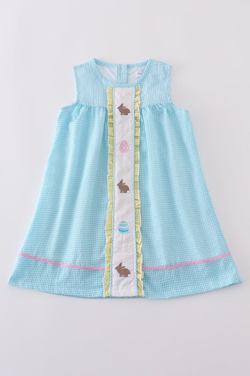A charming mint gingham dress with bunny and egg embroidery, perfect for Easter.