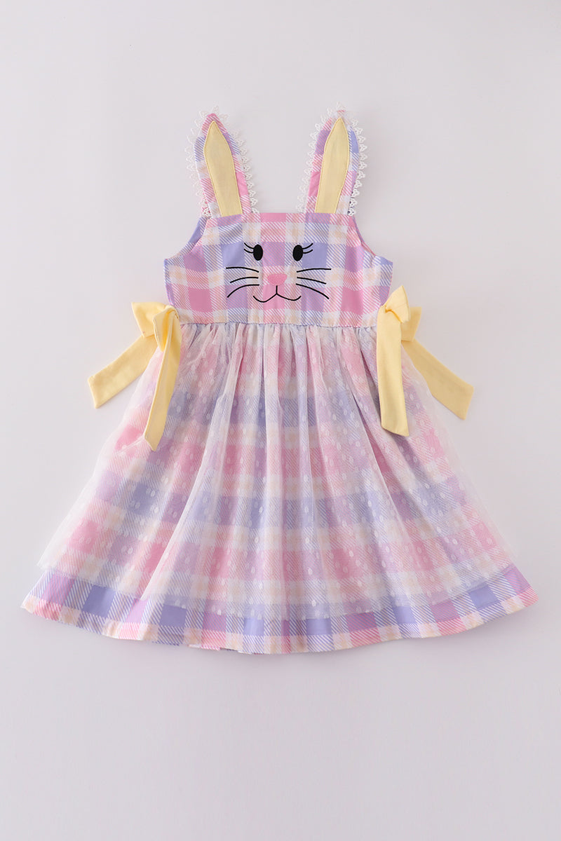 A charming pink plaid dress with bunny bow accents, perfect for springtime fun.