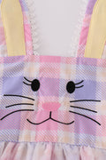 A charming pink plaid dress with bunny bow accents, perfect for springtime fun.
