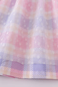 A charming pink plaid dress with bunny bow accents, perfect for springtime fun.