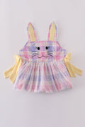 A charming pink plaid dress with bunny bow accents, perfect for springtime fun.