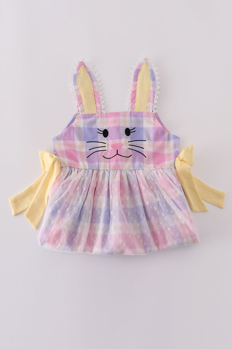 A charming pink plaid dress with bunny bow accents, perfect for springtime fun.