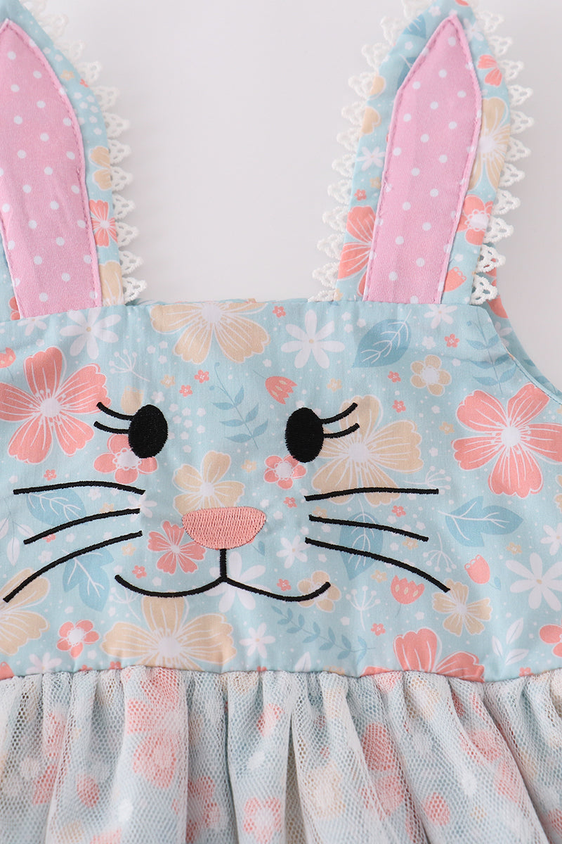 A charming green floral dress with bunny bow, perfect for springtime adventures.