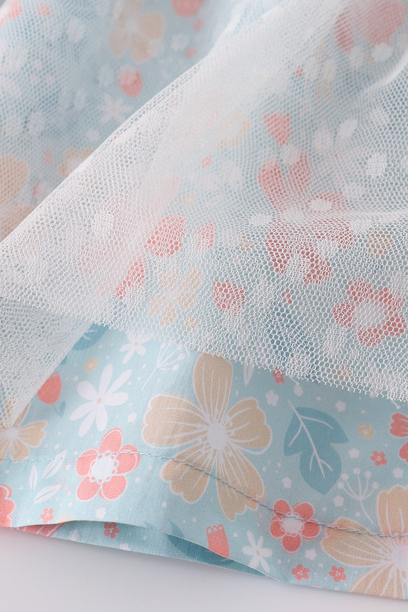 A charming green floral dress with bunny bow, perfect for springtime adventures.