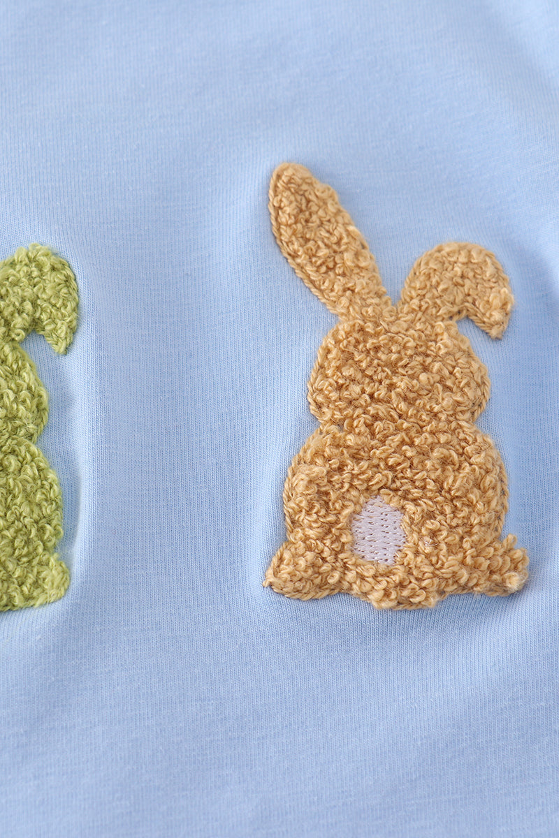 Premium blue romper with adorable bunny embroidery, perfect for playful spring days.
