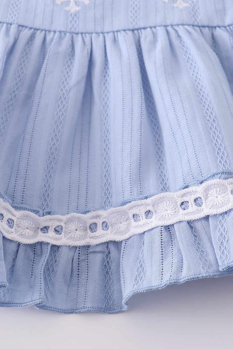 Cozy blue romper with charming cross embroidery, perfect for little ones.