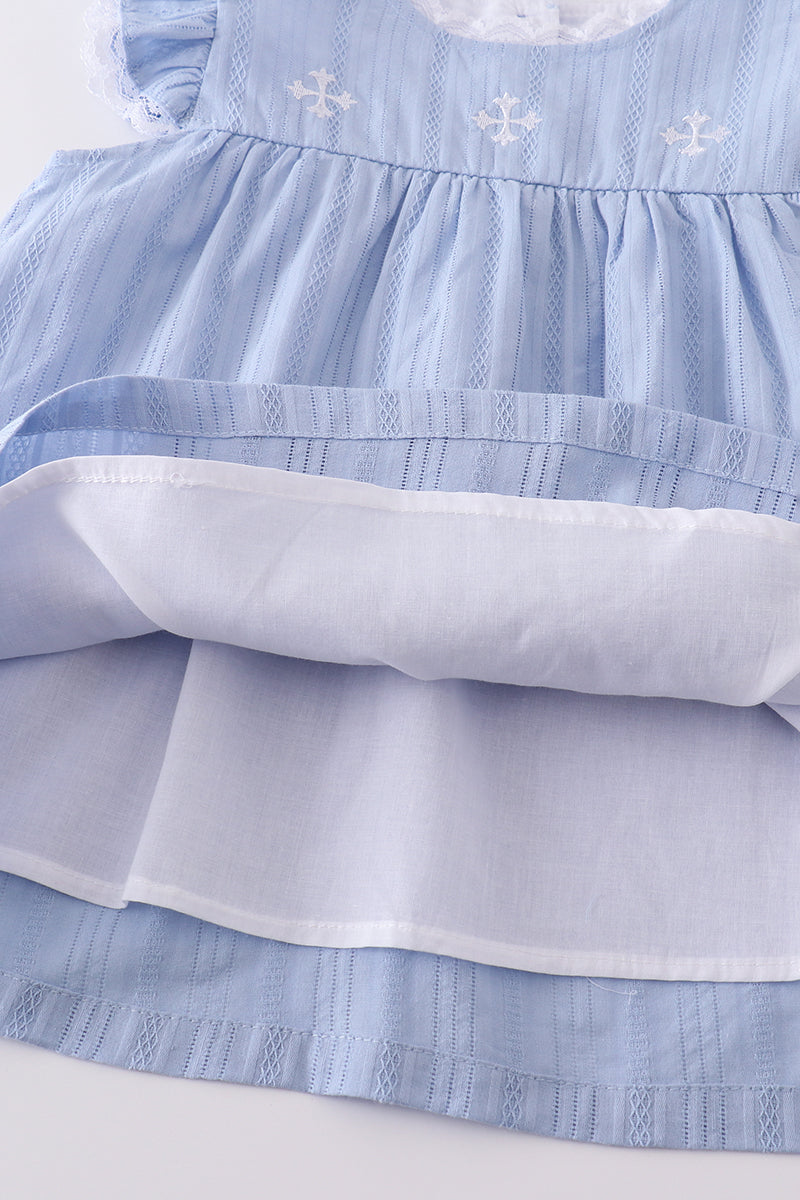 A cozy blue children's outfit with charming cross embroidery, perfect for special occasions.