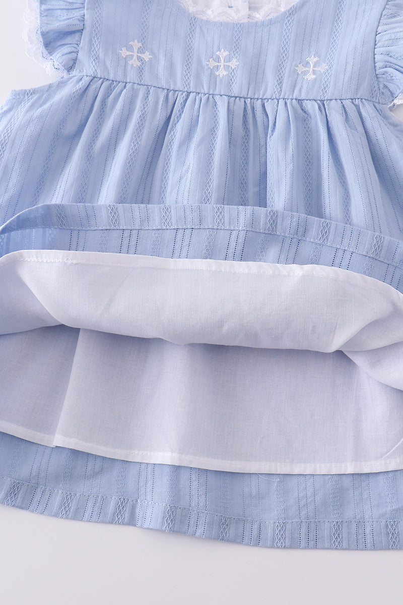 A cozy blue children's outfit with charming cross embroidery, perfect for special occasions.