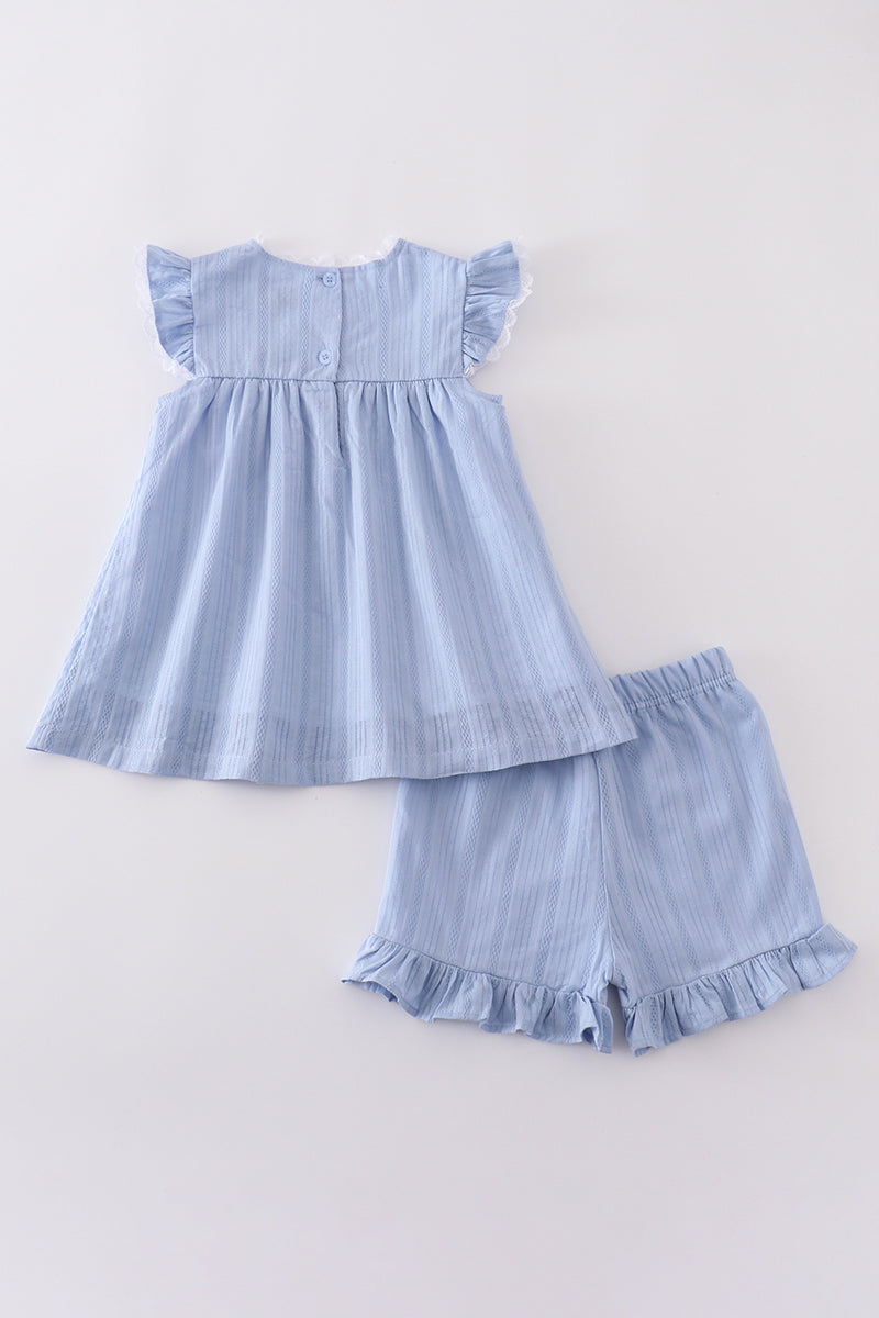 A cozy blue children's outfit with charming cross embroidery, perfect for special occasions.