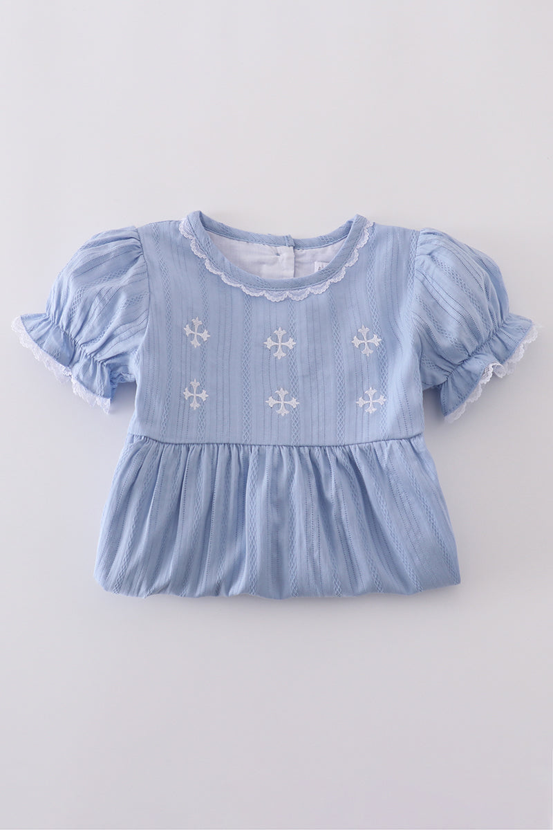 A charming blue dress with delicate cross embroidery, perfect for special occasions.