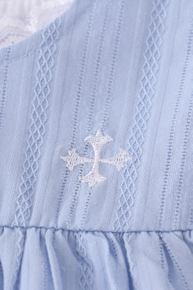 A charming blue dress with delicate cross embroidery, perfect for special occasions.