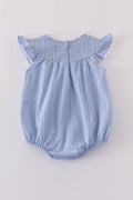 Premium blue bubble romper with charming cross embroidery, perfect for special occasions.