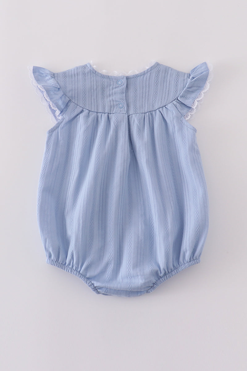 Premium blue bubble romper with charming cross embroidery, perfect for special occasions.
