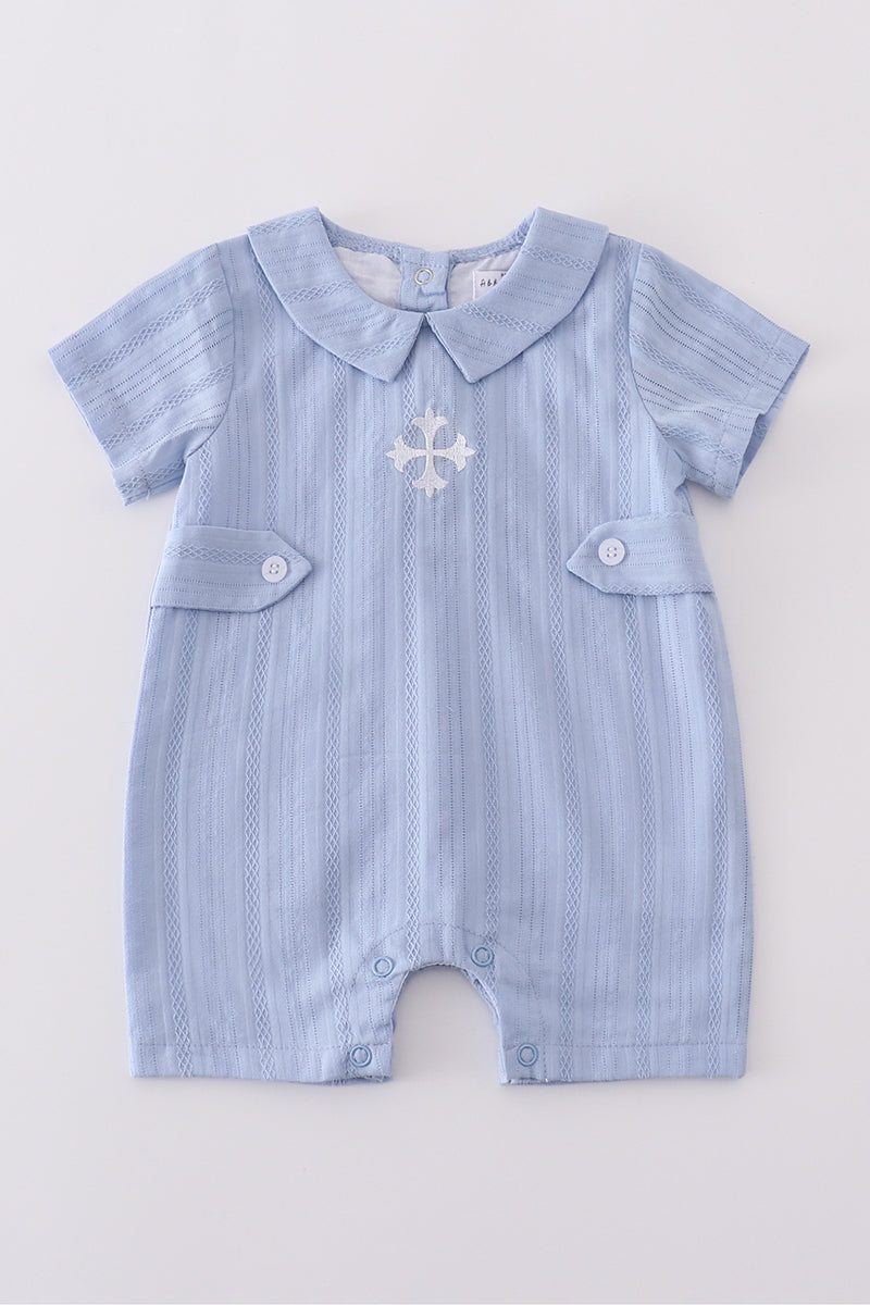 Cozy blue romper with charming cross embroidery, perfect for playful adventures.