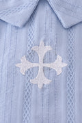 Cozy blue romper with charming cross embroidery, perfect for playful adventures.