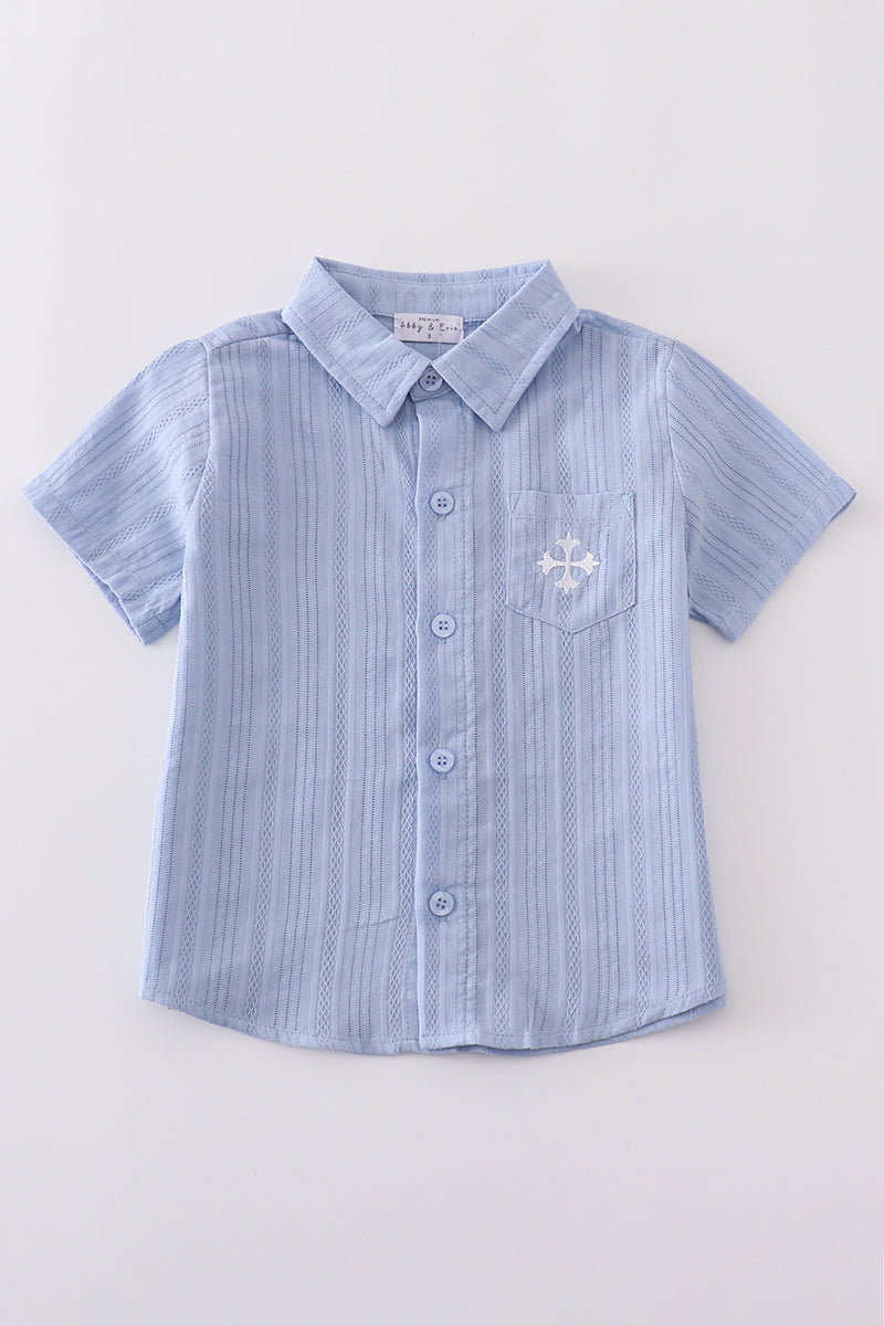 A charming blue button-down shirt with cross embroidery, perfect for kids.