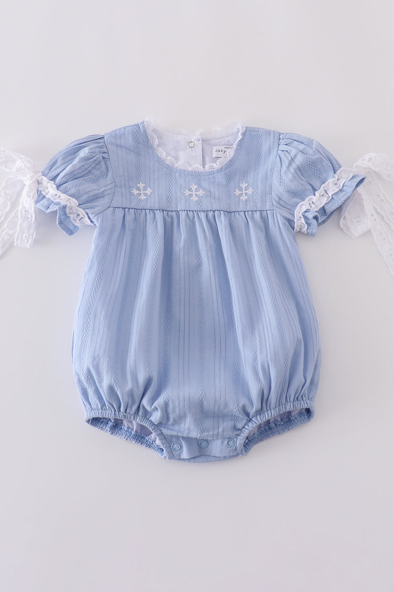 A cozy blue bubble romper with charming cross embroidery, perfect for playtime.