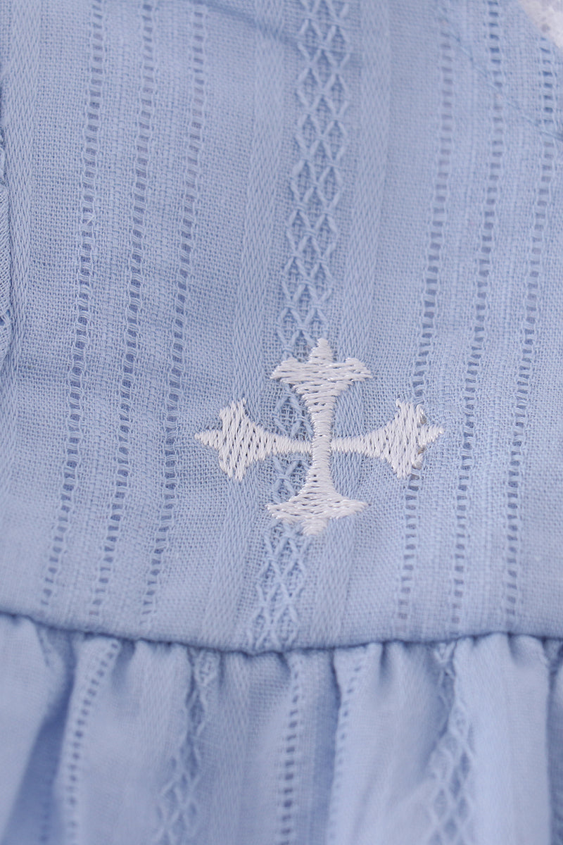 A cozy blue bubble romper with charming cross embroidery, perfect for playtime.