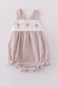 Premium brown bubble romper with charming cross embroidery, perfect for cozy playtime.