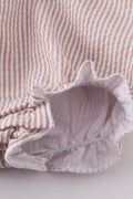 Premium brown bubble romper with charming cross embroidery, perfect for cozy playtime.