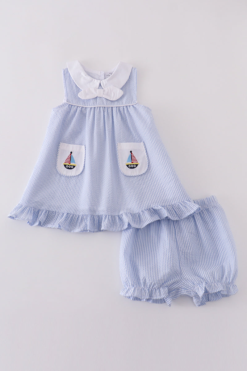 Adorable blue bloomer set with charming sailboat embroidery, perfect for summer adventures.