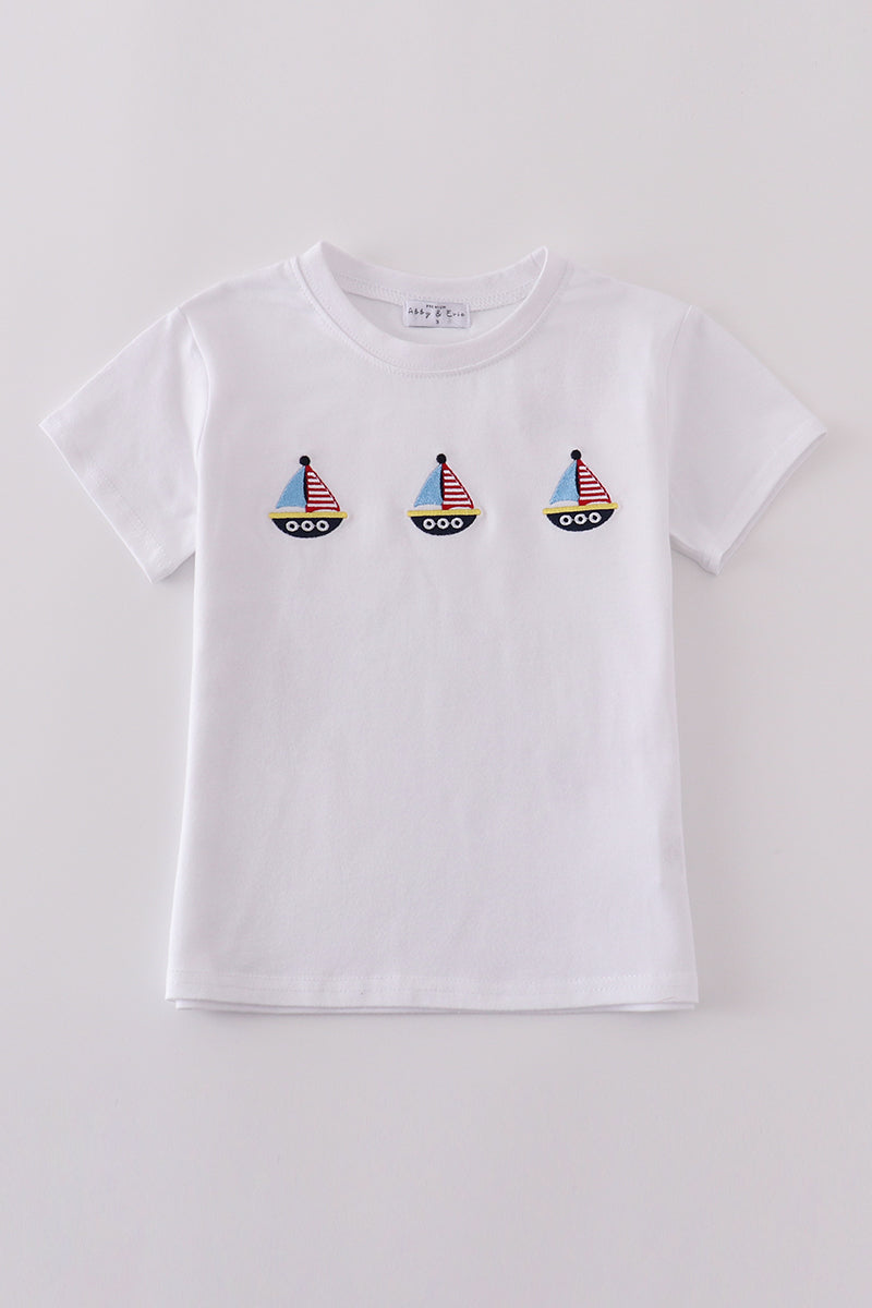Premium blue top with sailboat embroidery, perfect for playful summer days.