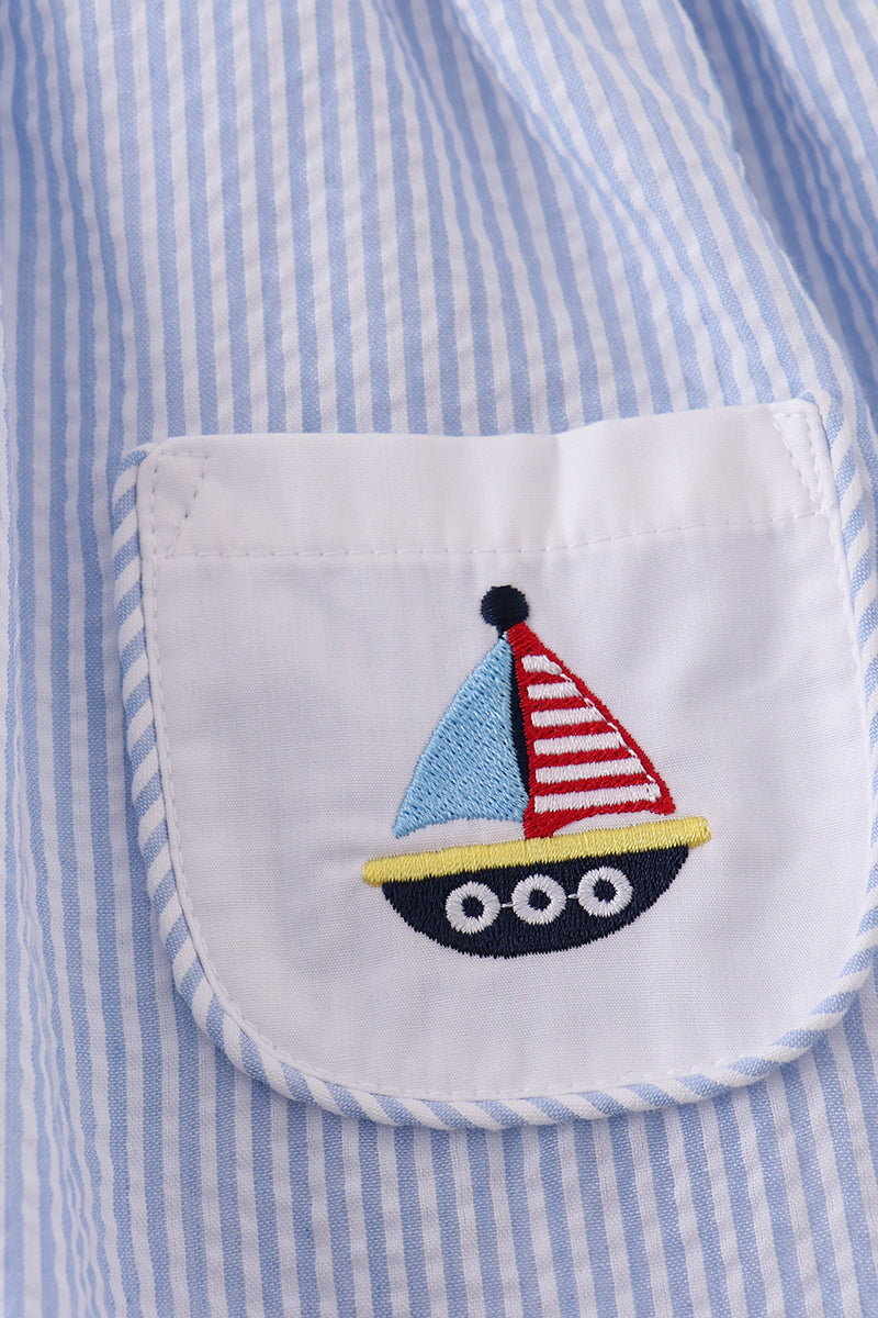 Premium blue dress with sailboat embroidery, perfect for a sunny day adventure.