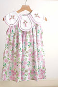 Pink Easter dress with floral embroidery and cross design, perfect for girls.