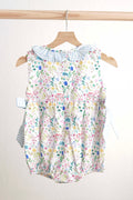 Floral Easter bunny hand-smocked girl bubble with pastel colors and ruffled sleeves.
