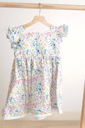 Floral Easter bunny hand-smocked dress with pastel colors and puffed sleeves.